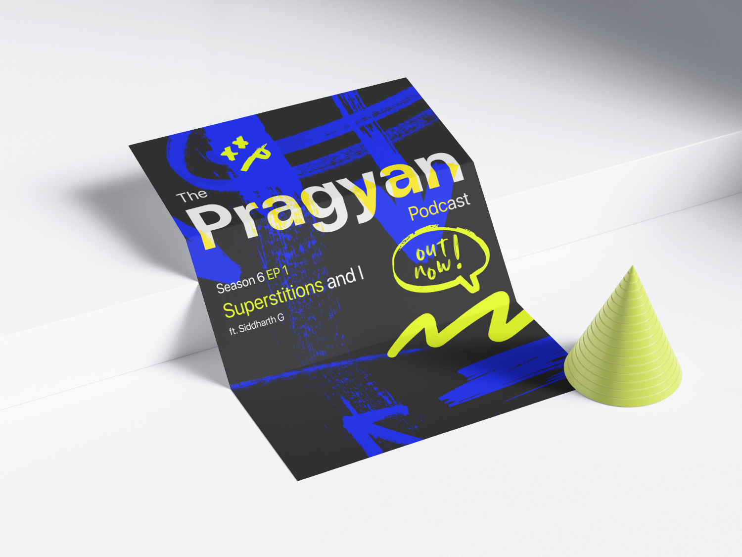 Pragyan Podcast flyer folded on a table