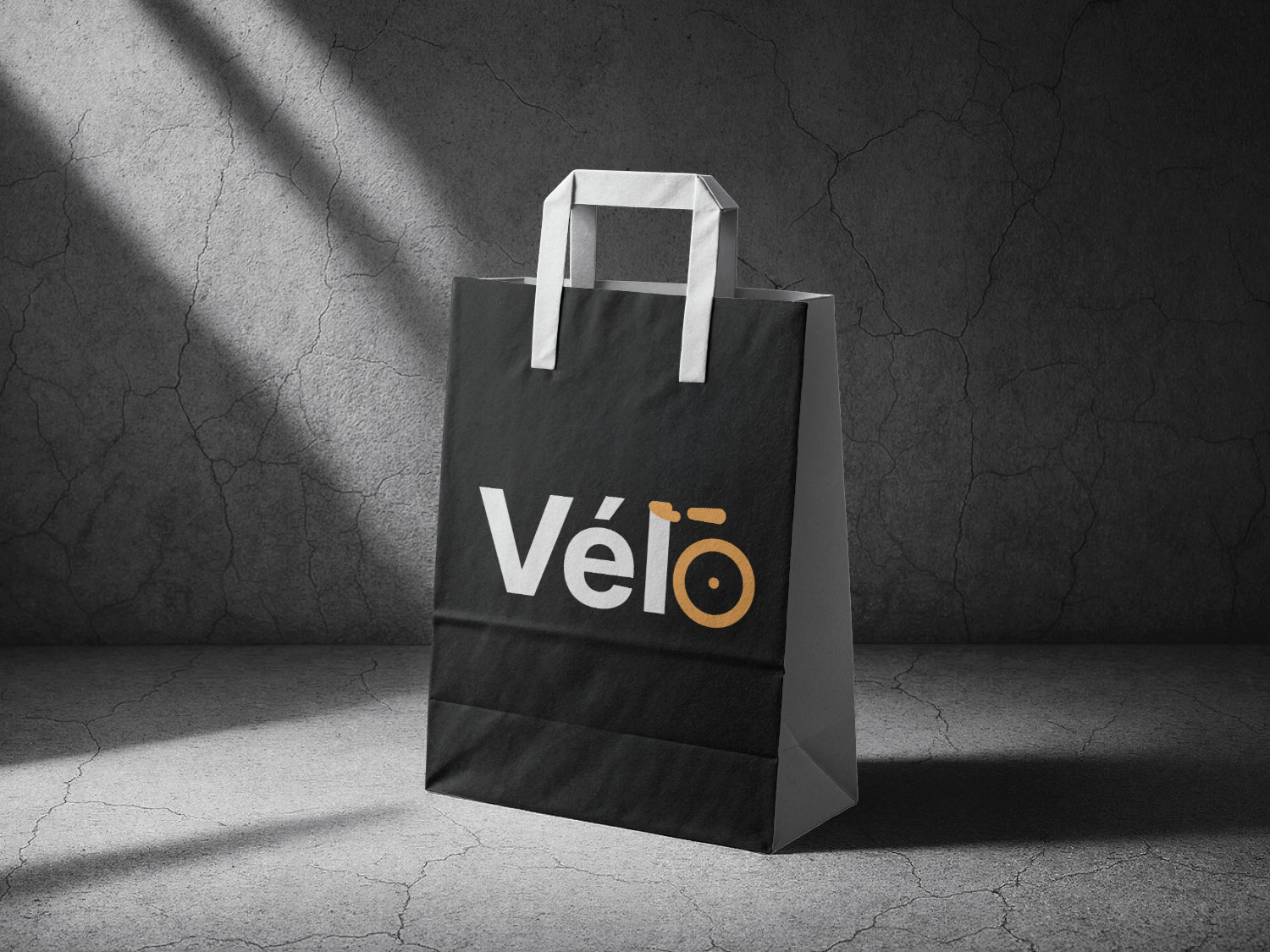 Two Vélo bags, black and white, on studio pedestals